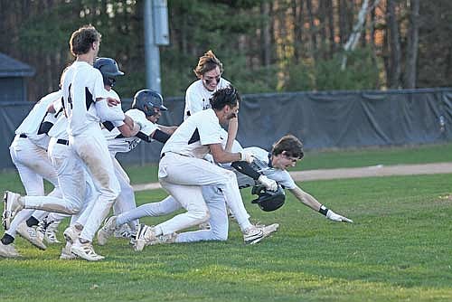 In this May 5, 2025 file photo, members of the Lakeland baseball team celebrate Benny Gahler’s (far right) walk-off home run against Medford at the Lakeland Union High School baseball field in Minocqua. Gahler’s blast gave the Thunderbirds the season series sweep over the Raiders for the first time in seven years. (Photo by Brett LaBore/Lakeland Times)