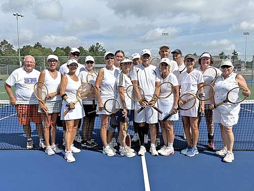 Local tennis players from the community gather for a photo during the Woods N’ Whites in Wisconsin celebration of Wimbledon Friday, July 11 at the Lakeland Union High School tennis courts in Minocqua. Individuals pictured, from left, are Tom Meisenheimer, Jeri Laurino, Donna Lesch, Craig Lewis, Nancy Lewis, Gwen Bilek, Ellie Glisczinski, Gretchen Goy, Ted Dasler, Bo Stalter, Cathy Stalter, Gary Blaskowski, Rick Hendrickson, Diane Blaskowski, Kate Buffington and Lenore Lopez. (Contributed photograph)