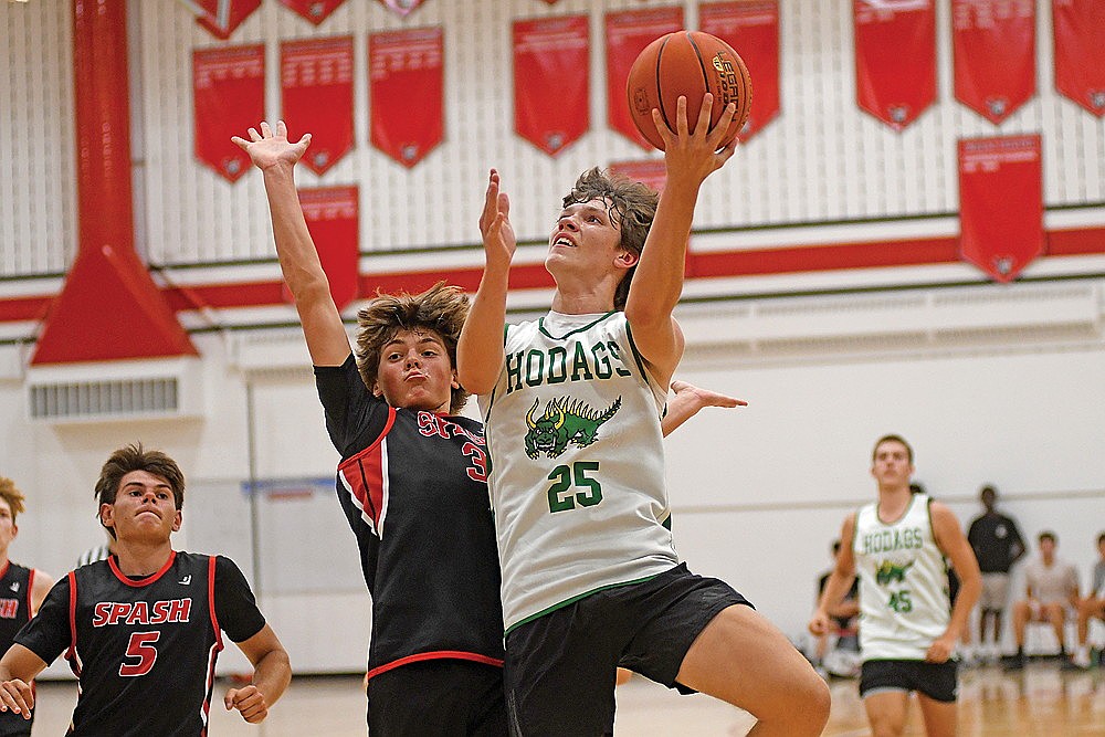 Jatyn Barkus drives to the basket during a Wausau League boys’ game against Stevens Point at Wausau East High School.