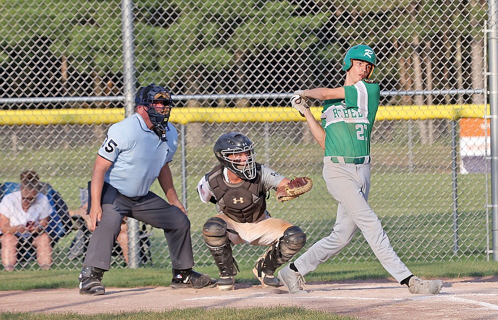 Rhinelander’s Vince White swings at a pitch during an American Legion baseball game at Minocqua Monday, July 14. White enters the postseason as the Rebels’ top player. He’s hitting a team-best .444 this summer with 10 RBIs and is 3-1 on the mound with a 1.69 ERA. (Bob Mainhardt for the River News)