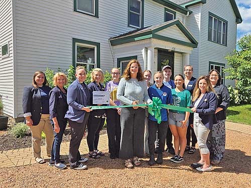 Pictured for the ribbon cutting, from left, are Lauren Sackett, Diane Sowinski, Jessica Mellinger, Tarsie Goes, Peyton Clark, Kelsy Bontz, Maddie Ewan, McKenna Brown, Zach Laxton, Julia Wacker, Renee Draszkiewicz, Cora Eckrich, Bobbie Keso-Mode. (Contributed photograph)