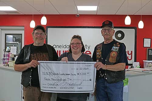 Red Knights Keith Durand (left) and Norm Peterson presented Oneida County Humane Society director Amanda Haydon with a $3,000 donation from a recent fund raising event in Rhinelander. (Photo by Beckie Gaskill/Lakeland Times)