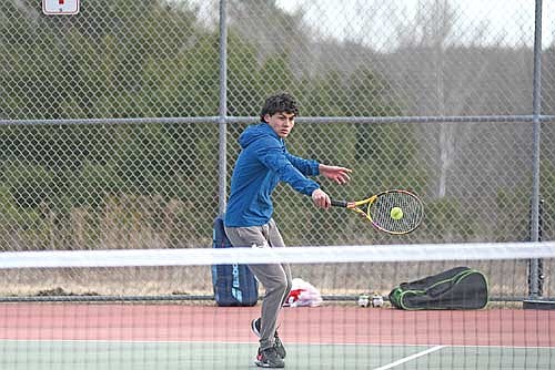 In this April 8, 2025 file photo, Dominic Gironella hits a back-handed shot in a non-conference match against Wausau East at the Wausau East High School tennis courts. Gironella made it to the state tournament for the second time in his career this season. (Photo by Brett LaBore/Lakeland Times)