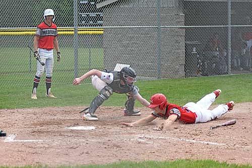Jack Stella tags out Medford’s Carson Carbaugh at home plate in the sixth inning of a Wisconsin American Legion Baseball Association Class AA Region 2 Tournament game Thursday, July 24 at the Minocqua Park Complex. (Photo by Brett LaBore/Lakeland Times)