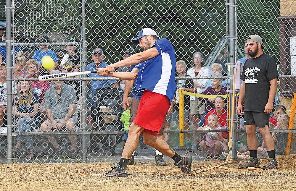 Jesse Robinson swats a home run to left field in the Snowhawks’ 13-6 win over Black Bear Bar Monday, July 28 at Snowshoe Park in Lake Tomahawk. (Brett LaBore/Lakeland Times)