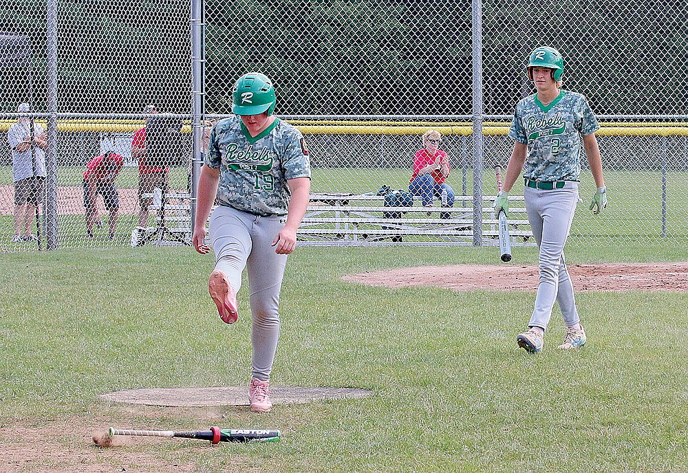 Rhinelander’s Tyler Chariton (19) and Abe Gretzinger (2) react after the final out of the Wisconsin American Legion Class AA Region 2 championship game against Medford in Minocqua Sunday, July 28. Medford defeated Rhinelander, 11-0, as it advanced to the state tournament for a third consecutive year. (Bob Mainhardt for the River News)