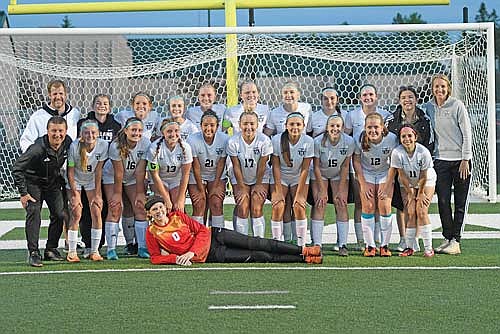 In this May 29, 2025 file photo, the Thunderbirds are all smiles following a 2-0 win over Rhinelander at Mike Webster Stadium in Rhinelander. The win gave Lakeland the co-conference championship with the Hodags, the fourth straight title for the Thunderbirds. Pictured, back row from left, are coach Jeff Fricke, Emma Bergquist, Lily Gindorff, Lila Biller, Lexi Gindorff, Cale Quade, Kasey Wise, Addie Hagen, Karsyn Dyre, manager Jadyn Wentland, head coach Stephanie Hartzheim; middle row, coach Ihor Myshchyshyn, Bobbi Lee, Molly Jorgensen, Landry Lenz, Tayiah Bauman, Maya Savel, Justine Abel, Jenna Klappa, Rosa Hornig, Makayla Solis; front, Ava Evenhouse. (Photo by Brett LaBore/Lakeland Times)
