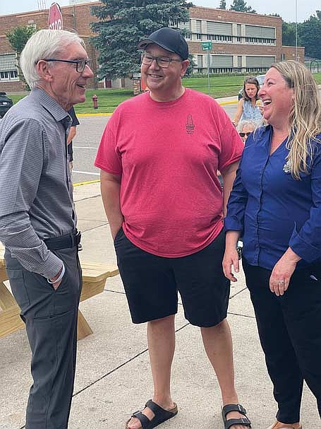 Wisconsin governor Tony Evers talks to Kevin and Holly Briquelet-Miller, owners of Briq’s Soft Serve at Jet’s Dairy Bar in Rhinelander on Wednesday, July 30. (Photo by Brian Jopek/Lakeland Times)