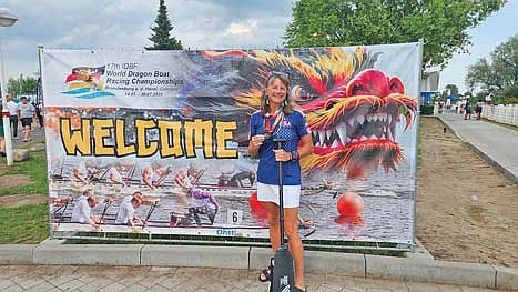 Lori Manion poses with a medal at the 17th International Dragon Boat Federation World Dragon Boat Racing Championships July 14-20 in Brandenburg an der Havel, Germany. Manion won eight medals. (Contributed photograph)