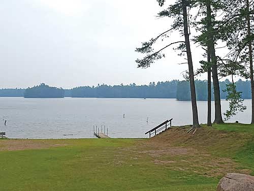 Wildfire smoke casts a haze over Lake Katherine in Hazelhurst on Thursday, July 31. (Photo by Michael Strasburg/Lakeland Times)