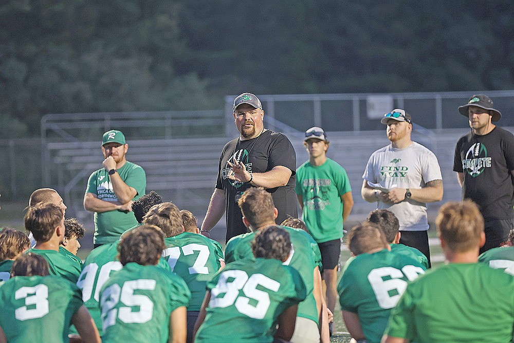Rhinelander High School football coach Aaron Kraemer addresses his team following practice at Mike Webster Stadium Tuesday, Aug. 5. Tuesday marked the first official day of practice for high school football teams in Wisconsin. (Bob Mainhardt for the River News)