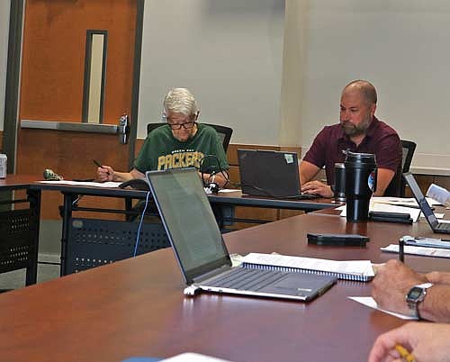 Vilas County forest administrator Chad Keranen spoke about the acquisition of a 40-acre property surrounded on three sides by county land, explaining the potential of the property to chair Holly Tomlanovich and others on the forestry, recreation and land committee. (Photo by Beckie Gaskill/Lakeland Times)