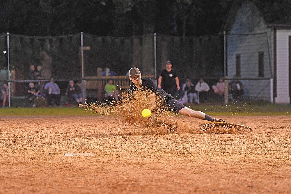 Anthony Caroselli of Fricken Restaurants makes a diving attempt in the sixth inning of a snowshoe baseball game against the Snowhawks Monday, Aug. 11 at Snowshoe Park in Lake Tomahawk. (Brett LaBore/Lakeland Times)