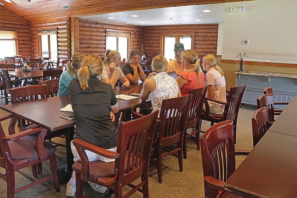 Members of the Rhinelander High School girls’ golf team meet with coach Adam Schmidt prior to the start of practice Tuesday, Aug. 12 at Northwood Golf Club. (Jeremy Mayo/River News)