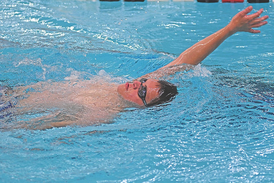 Joey Jurries does the backstroke during a practice Monday, Aug. 11 at the Lakeland Union High School pool in Minocqua. Jurries bested an age group world record in the 50 backstroke at 36.63 seconds leading up to the Virtus World Swim Championships Aug. 24 through 30. (Photo by Brett LaBore/Lakeland Times)