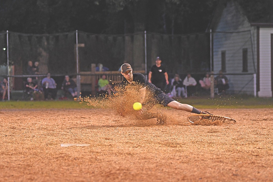Anthony Caroselli of Fricken Restaurants makes a diving attempt in the sixth inning of a snowshoe baseball game against the Snowhawks Monday, Aug. 11 at Snowshoe Park in Lake Tomahawk. (Photo by Brett LaBore/Lakeland Times)
