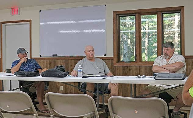 The Lynne town board met last week to discuss needed repairs on Willow Road. Pictured, from left, are board members Tim Karau and Jeff Brown, and town chair Jeff Viegut. (Photo by Beckie Gaskill/Lakeland Times)