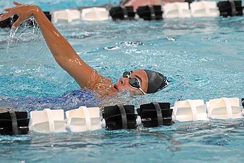 Olivia Mickle does the backstroke during the first day of practice Tuesday, Aug. 12 at the Lakeland Union High School pool in Minocqua. Mickle is back for one more season, looking to better her school-record times. (Photo by Brett LaBore/Lakeland Times)
