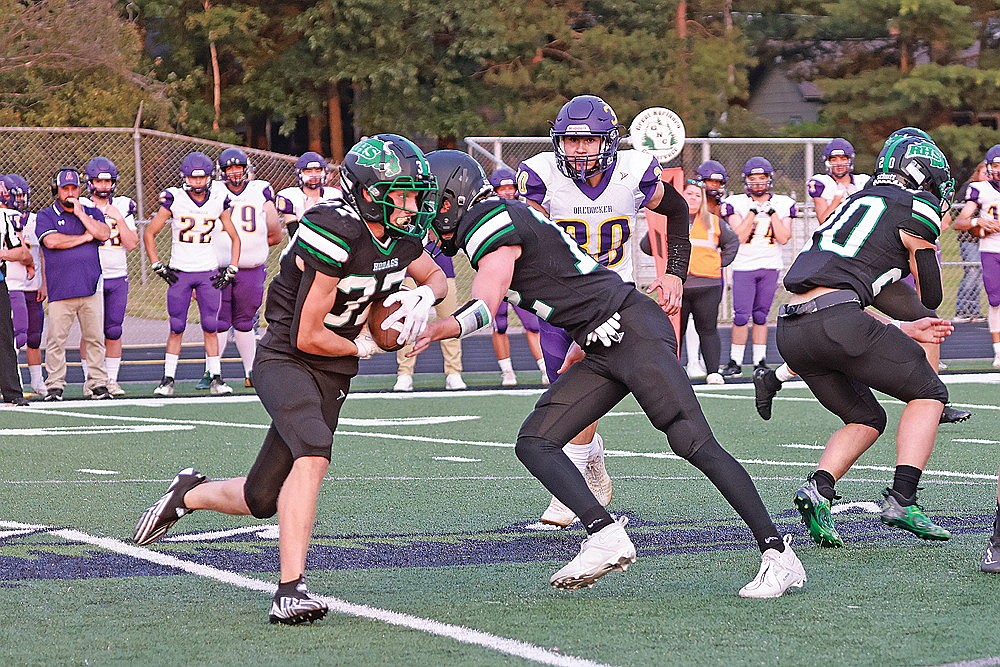 In this Aug. 23, 2024 file photo, Rhinelander’s Cyrus Leisure takes a handoff during a non-conference football game against Ashland at Mike Webster Stadium. The Hodags and Oredockers meet again tonight to kick off the 2025 season. Rhinelander won last year’s meeting, 20-0, with Leisure rushing for 103 yards and a touchdown. (Bob Mainhardt for the River News)