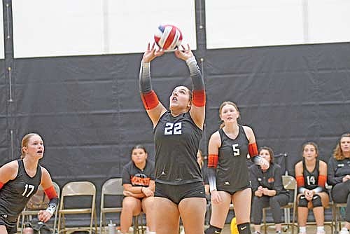 Anya Brandenburg tips the ball for a set as Stella Thompson watches during a scrimmage against Lakeland Saturday, Aug. 23 at the Lakeland Union High School fieldhouse in Minocqua. (Photo by Brett LaBore/Lakeland Times)