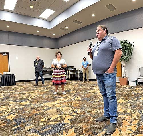 John Johnson, Sr., left, president of the Lac du Flambeau Band of Lake Superior Chippewa Indians, listens to remarks from Bryan Bainbridge, chief executive officer of the Great Lakes Inter-Tribal Council (GLITC), at the start of an emergency management summit at the Lake Of The Torches Casino on Aug. 14. Also in the photo are GLITC staff members Kimberlee McGeshick and Jacob Riemer. (Contributed photograph)