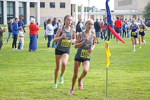 Emerson Rubo leads Addison Eggen during the Hodag Invite Thursday, Aug. 28 at Rhinelander High School. Rubo and Eggen both finished in the top five of the large school division in their high school debuts. (Photo by Jeremy Mayo/River News)
