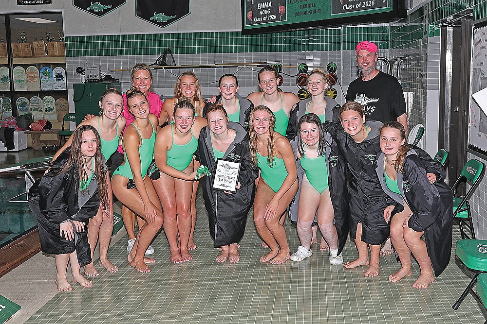 The Rhinelander High School girls’ swim team poses with the championship plaque after winning the Hodag Relays invite at the Heck Family Community Pool Wednesday, Aug. 27. Pictured in the front row, from left to right, are Maria Craig, Kiley Pooch, Ella Heck, Emma Houg, Millie Gruett, Vivian Lamers, Kyleigh Kennedy, Aubree Edwardson and Hailey Novak. In the back row are head coach Jenny Heck, June Chiamulera, Lola Beach, Rylee Mickevicius, Kyree McMahon and assistant coach Brent Olson. (Bob Mainhardt for the River News)