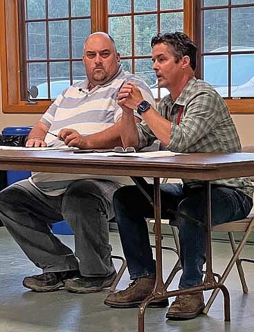 Vilas County zoning administrator Dave Sadenwasser, left, and Tom Shockley with the Wisconsin Department of Natural Resources made presentations and answered questions at an Arbor Vitae community meeting on Sept. 2. (Photo by Brian Jopek/Lakeland Times)