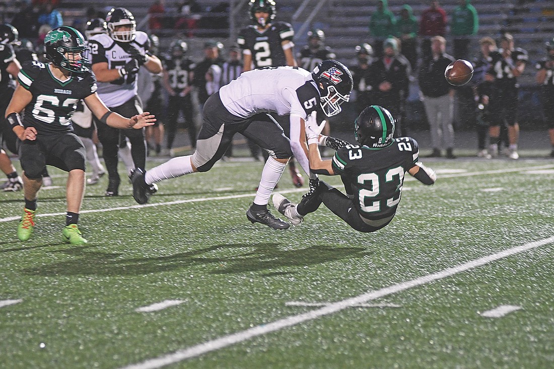 Evan Zoch forces a fumble from Rhinelander’s Ben Olson in the second quarter of the Axe Game Friday, Sept. 5 at Mike Webster Stadium in Rhinelander. Zoch picked the ball up and scored a touchdown. (Photo by Brett LaBore/Lakeland Times)