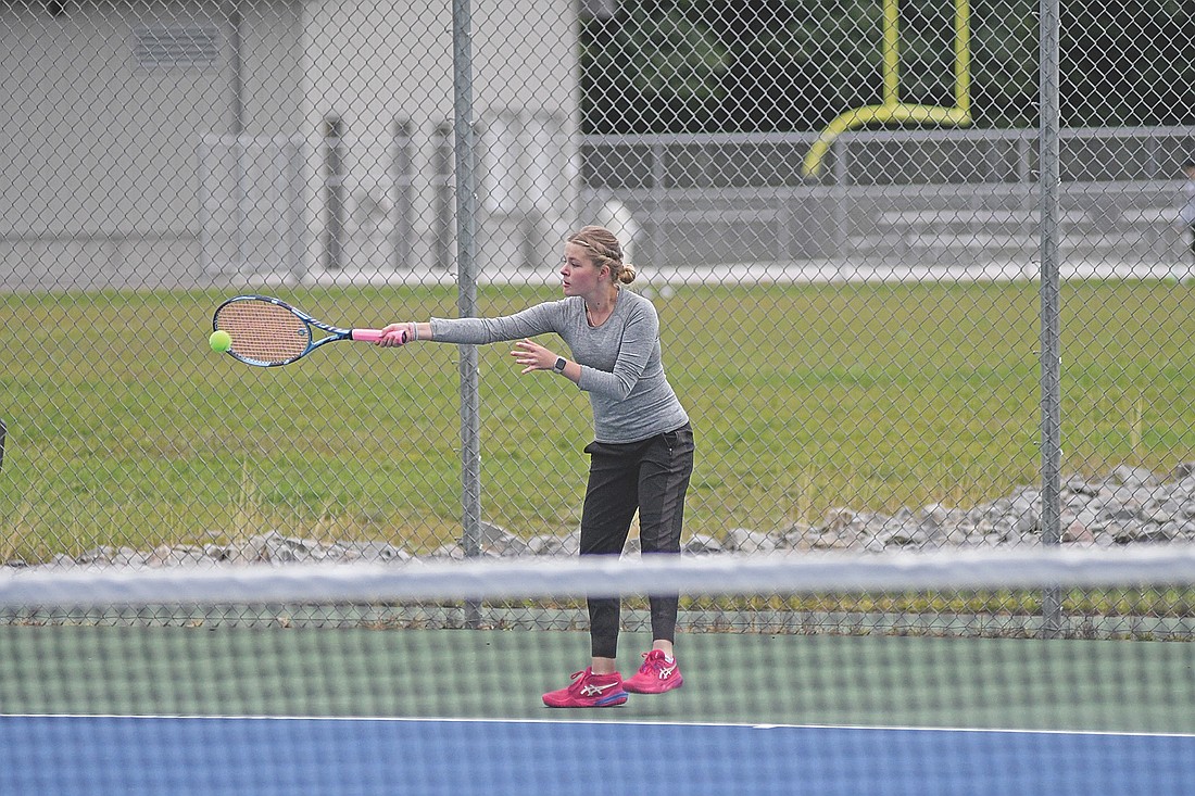 Vella Walden keeps the play alive in her No. 4 singles match against Merrill Thursday, Sept. 4 at the Lakeland Union High School tennis courts in Minocqua. Walden started her match last Thursday before finishing on Monday. (Photo by Brett LaBore/Lakeland Times)