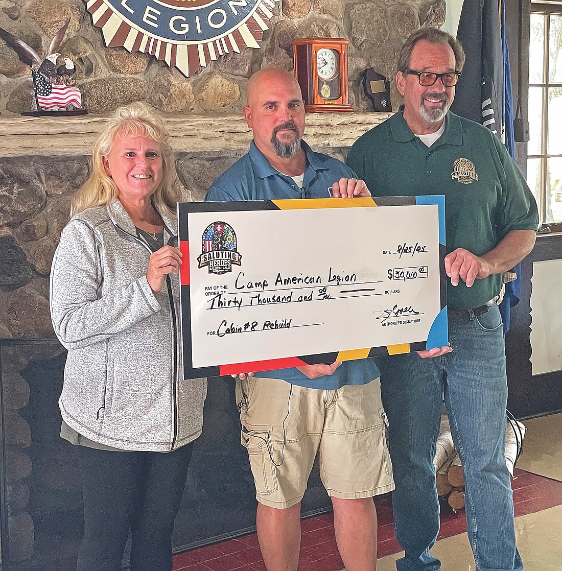 Nancy Woller, Camp American Legion director Jim Klement and Steve Woller at last month’s check presentation in the main lodge at Camp American Legion. (Photo by Brian Jopek/Lakeland Times)