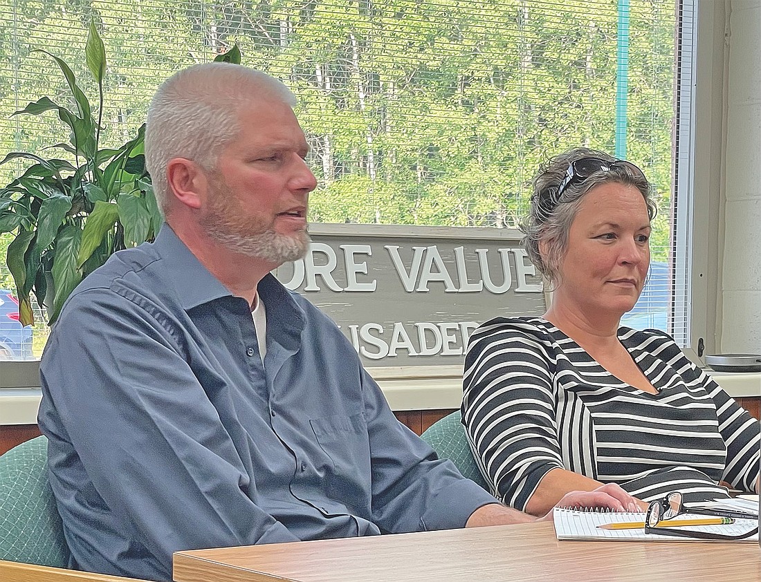 Arbor Vitae-Woodruff school district administrator Dr. Jocelyn Hardy, right, listens as district principal Rich Fortier makes his report to the AV-W school board at its Sept. 8 meeting. (Photo by Brian Jopek/Lakeland Times)