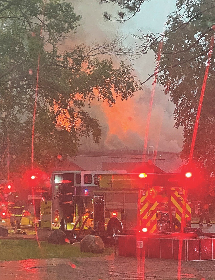 A scene viewed from the cab of an ambulance with the Plum Lake emergency medical service shows a fire truck with the Arbor Vitae fire department at the at Waldmann Construction in St. Germain. (Contributed photograph)