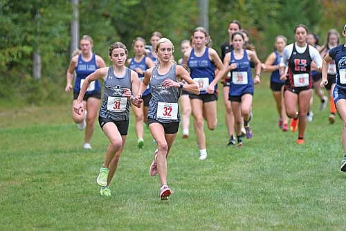 Emerson Rubo, front, and Addison Eggen lead a pack of runners at the start of the Ted Voigt Invite Thursday, Sept. 11 at Minocqua Winter Park. Rubo and Eggen had the top two times in the field. (Photo by Brett LaBore/Lakeland Times)