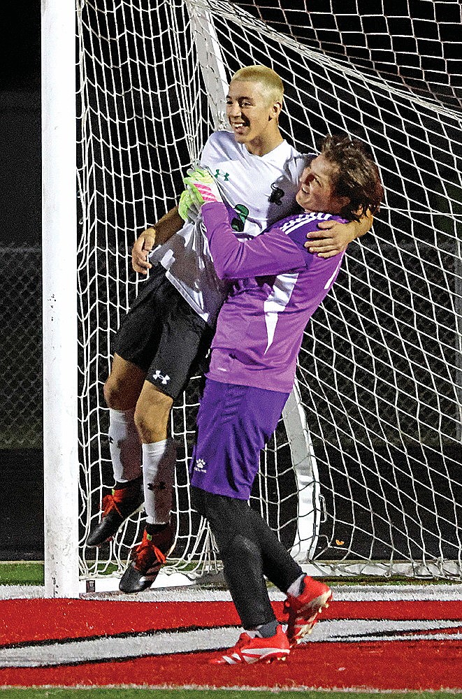 Rhinelander’s Caden Ehrhardt, right, lifts Asher Rivord in celebration following a GNC boys’ soccer game at Medford Thursday, Sept. 11. Rivord converted a penalty kick that clinched a shootout victory for the Hodags over the Raiders after the teams played to a 0-0 draw in regulation. (Matt Frey/Star News)