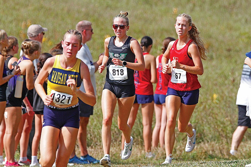 Rhinelander’s Kara Monk races in the final mile of the SPASH Invite cross country race at Standing Rocks Park in Stevens Point Saturday, Sept. 13. (Jeremy Mayo/River News)