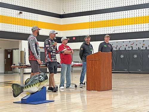 Professional angler Matt Becker of Ten Mile, Tenn. speaks about his life fishing for a living while fellow pro Spencer Shuffield of Hot Springs, Ark., left, MFL senior director of communications Joe Opager, fellow pro Ott DeFoe and fellow pro Andy Montgomery wait their turns to speak next. (Photo by Trevor Greene/Lakeland Times)
