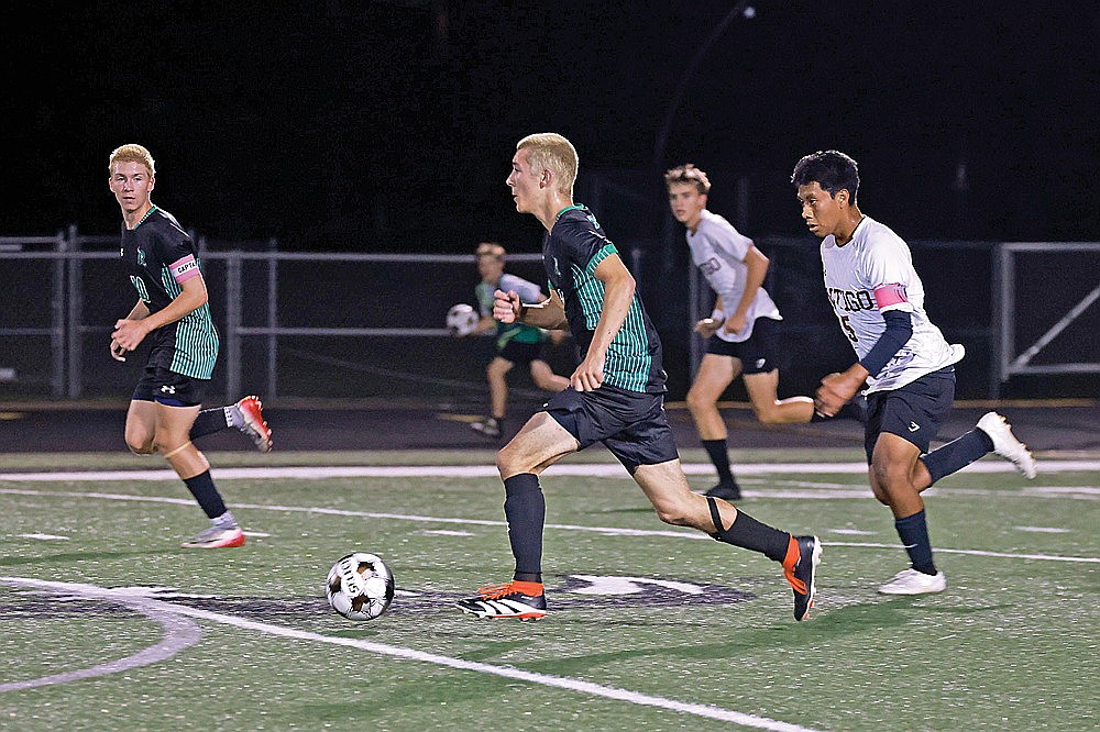 Rhinelander’s Asher Rivord brings the ball upfield while Antigo’s Diego Flores Martinez trails the play during the first half of a GNC boys’ soccer game at Mike Webster Stadium Tuesday, Sept. 23. Rivord had the Hodags’ lone goal in a 4-1 defeat. (Bob Mainhardt for the River News)