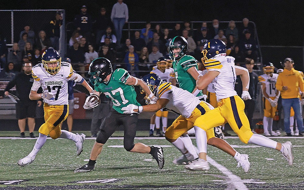 Rhinelander’s Cyrus Leisure looks to break a tackle against Tomahawk’s Jonah Dickens during the first quarter of a GNC football game at Mike Webster Stadium Friday, Sept. 19. The Hodags are looking to get their ground game back on track this week against an Antigo team that has allowed more than 290 yards per game on the ground so far in GNC play. (Bob Mainhardt for the River News)