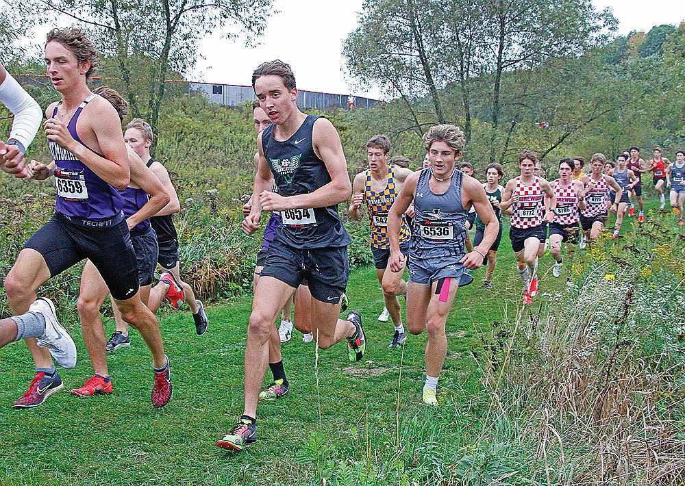 Rhinelander’s Avrom Barr races in a pack in the opening mile of the Bill Smiley Invitational cross country race in Wausau Saturday, Sept. 20. Barr finished 17th in the boys’ division 1 race, leading the RHS boys’ contingent to a 14th place finish in the team standings. (Jeremy Mayo/River News)