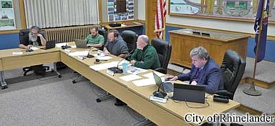 The Rhinelander city council took up the matter of whether or not there should be two more four-way stops downtown to help control traffic and increase walkability. Pictured, from left, are alderman Thomas Barnett city clerk Austyn Zarda, mayor Kris Hanus, city administrator Patrick Reagan and city attorney Steve Sorenson. (Contributed image)