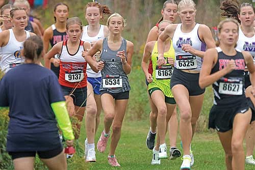 Emerson Rubo runs with a pack of runners during the Bill Smiley Invite Saturday, Sept. 20 at Wausau East High School. Rubo picked up a new personal record at 20:19. (Photo by Jeremy Mayo/River News)