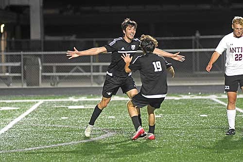 Kaden Carlson celebrates his goal with Cam Bernard in the second half of an 8-0 victory over Antigo Thursday, Sept. 25 at IncredibleBank Field in Minocqua. The goal was Carlson’s first on varsity. (Photo by Brett LaBore/Lakeland Times)