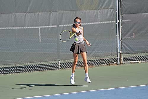 Sierra Wallace leaves her feet for a groundstroke in her No. 1 singles match against Merrill during the Great Northern Conference tournament Thursday, Sept. 25 at the Rhinelander High School tennis courts. Wallace went on to take third place at No. 1 singles. (Photo by Brett LaBore/Lakeland Times)