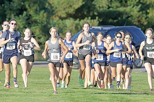Emerson Rubo, left, and Addison Eggen take off from the start of the Three Lakes Invite Thursday, Sept. 25 at Big Stone Golf Course. Rubo won with a time of 20:52.1, and Eggen took third with a time of 21:22. (Photo by Jeremy Mayo/River News)