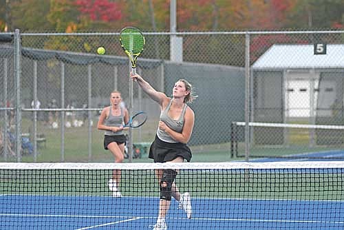 Addison Trapp delivers an overhead smash in her No. 1 doubles match against Ironwood, Mich. Monday, Sept. 29 at the Lakeland Union High School tennis courts in Minocqua. Trapp and partner Nora DeVries won 6-2, 6-3, their first win as a duo. (Photo by Brett LaBore/Lakeland Times)