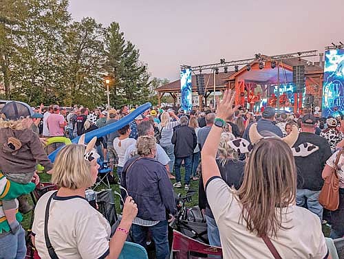 The band IV Play revs up the Beef-A-Rama crowd from the Lions Club Beer Garden stage at Torpy Park on Saturday, Sept. 27, in Minocqua. (Photo by Dean Hall/Lakeland Times)