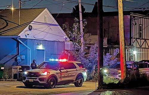 Minocqua police officers take a suspect into custody in an alley between Chippewa and Oneida Streets on Saturday, Sept. 27, in downtown Minocqua. (Photo by Dean Hall/Lakeland Times)