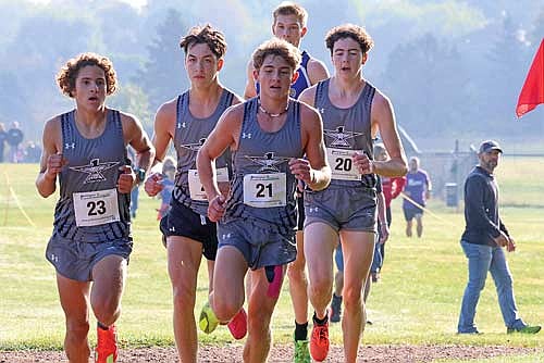 Thunderbirds, from left, Brayden Kelly, Parker McKinney, Charlie Ernst and Barrett Eggen take part in the Merrill Invite Saturday, Sept. 27 at Merrill High School. The Lakeland boys took first as a team with Ernst winning individually at 17:52.25. (Photo by Matt Frey/Star News)