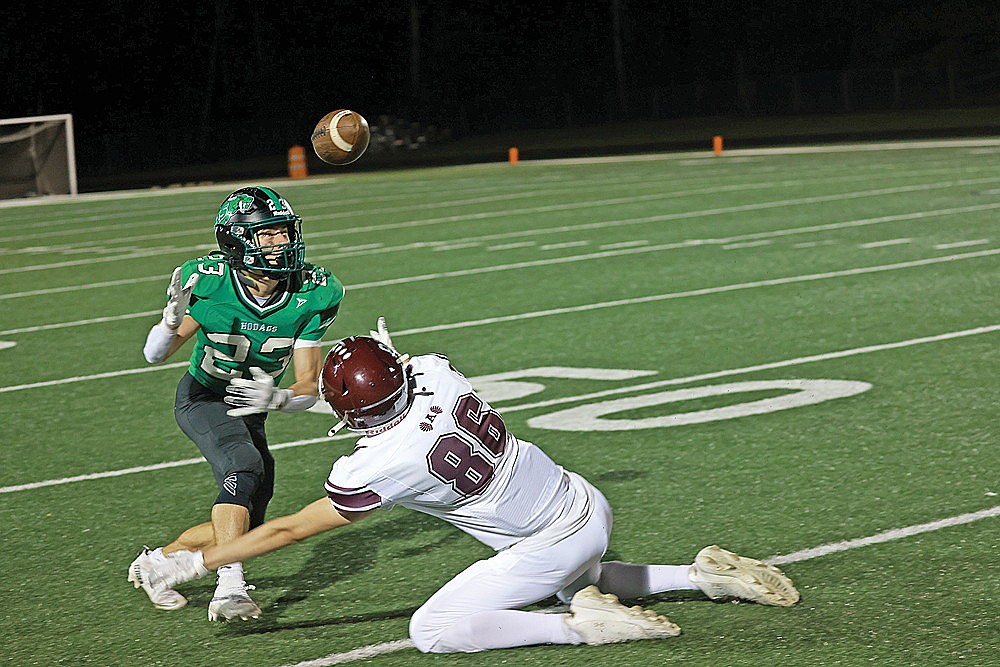 Rhinelander’s Ben Olson attempts to intercept a pass off a deflection by Antigo’s Seth Krueger (86) during the first quarter of the 91st Bell Game against Antigo at Mike Webster Stadium Friday, Sept. 26. Rhinelander’s passing game will be tested against a Mosinee offense that averages 159 yards per game and 7.7 yards per completion. (Bob Mainhardt for the River News)